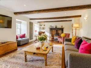a living room with a couch and a coffee table at 5 Bed in Crickhowell oc-90053 in Crickhowell