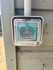 a small sign with a car on it at Chambre & Caux in Thiergeville +9 photos