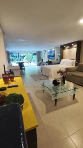 a large living room with a bed and a couch at Casaloft994 in Bento Gonçalves