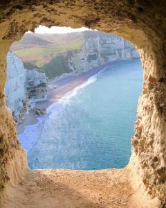 a view of the ocean from a cave at Chambre & Caux in Thiergeville