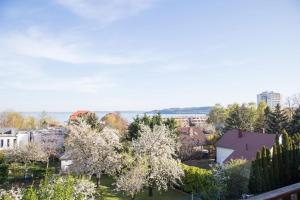 a view of a city with trees and buildings at Balkonett Vendégház in Balatonfüred