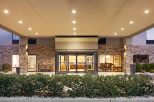a lobby of a building with windows and bushes at Hampton Inn Frostburg in Frostburg
