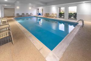 a large pool with blue water in a hotel room at Hampton Inn Frostburg in Frostburg