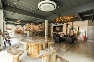a room with tables and chairs and a kitchen at HOST'S EL Fisherman in Nathon Bay