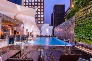 a pool on the rooftop of a building at Hilton Bogotá in Bogotá