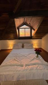a bedroom with a white bed with a window at Abraham's 4 BHK villa, By Gonserv in Jāmb +17 photos