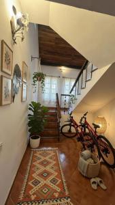 a bike parked in a room with a staircase at Abraham's 4 BHK villa, By Gonserv in Jāmb