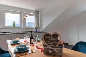 a table with a heart sign on it in a kitchen at Grünten-Chalet in Oy-Mittelberg