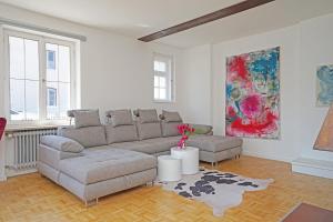a living room with a couch and two chairs at Villa Primavera in Nesselwang