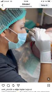 a woman in a operating room with a mask on her mouth at mutlu genç dur in Atakum