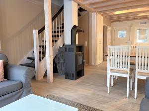 a living room with a couch and a table at Ferienhaus Oceansounds in Sierksdorf