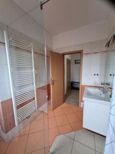 a bathroom with a sink and a mirror at Apartmány pod Divadlem in Znojmo +29 photos