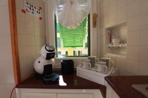 a kitchen with a penguin figurine on a counter at Lido di Ostia 1933 in Lido di Ostia