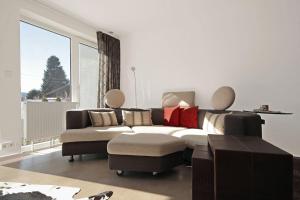 a living room with a couch and a table at N-Appartement Falkenstein in Nesselwang