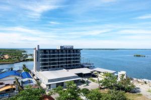 a hotel with a view of the water at PROXY Plus Pangasinan in Alaminos