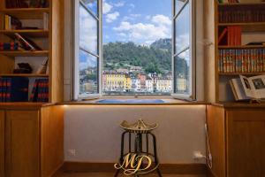 a room with a window with a view of a city at MYD - The Jules Verne in Grenoble
