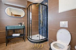 a bathroom with a shower and a toilet at MYD - The Jules Verne in Grenoble +15 photos