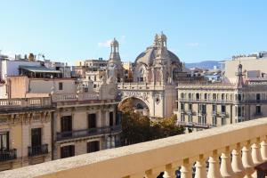 a view of a city from a balcony at Hamilton Suites in Barcelona