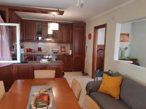 a living room with a couch and a table at Villa Belvedere Flogita in Flogita