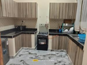 a kitchen with a counter top that is covered in marble at Luxury Homes in Mtwapa