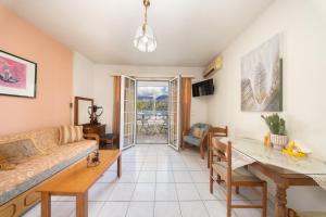 a living room with a couch and a table at Myros Studios in Argostoli