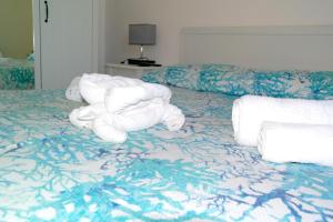 a hotel room with towels on a bed at Lost In Amalfi in Amalfi