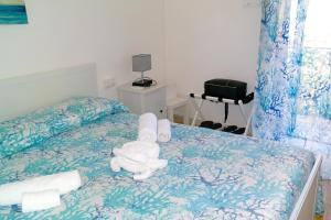 a bedroom with a bed with towels on it at Lost In Amalfi in Amalfi +26 photos