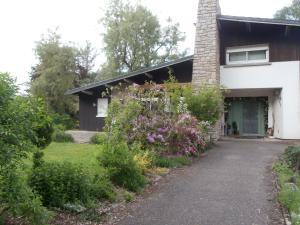a house with a driveway in front of it at Canopée in Saint-Nabord