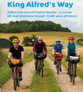 a group of people riding bikes down a dirt road at The Swallows Rest, Avebury in Avebury