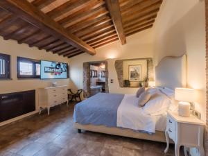 a bedroom with a bed and a flat screen tv at Vogue Hotel Arezzo in Arezzo +48 photos