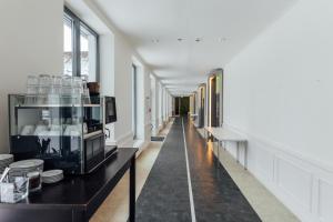 a corridor of a building with a long hallway at Hotel Heideblick an der Lüneburger Heide in Jesteburg