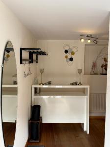 a dressing room with a mirror and a dressing table at Hotel Central - Self Check-in in Luchsingen +40 photos
