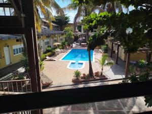 a view of the pool from the balcony of a hotel at Hotel Master Cuiabá in Cuiabá