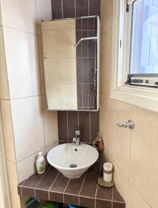 a bathroom with a sink and a mirror at Οικία Χωρας Κυθνου in Kithnos +14 photos