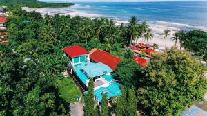an aerial view of a house on the beach at Green Lodging House in Anda