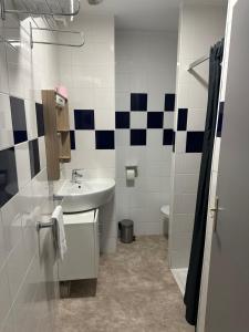 a bathroom with a sink and a toilet at Hôtel Le Prince, Poitiers Gare in Poitiers