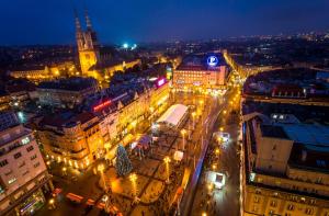 an overhead view of a city at night with lights at Apartments Petrova170 in Zagreb