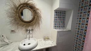 a bathroom with a white sink and a mirror at Dar Yessine Boutique Hôtel in Sousse +152 photos