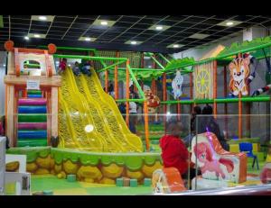 a child playing in a play room with a playground at Serene 3-Bedroom House in Pridelands, Nairobi in Syokimau