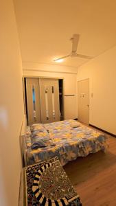 a bedroom with two beds in a room at Hm home 2 in Sepang