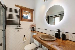 a bathroom with a sink and a mirror at La Pelusa casa rural in La Culata +31 photos