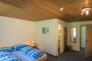 Postel nebo postele na pokoji v ubytování juhui Lenzerheide