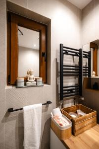 a bathroom with a sink and a mirror at Fly Residence 2 in Arad +11 photos