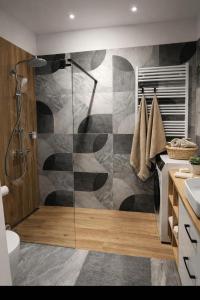 a bathroom with a shower and a sink at MODERN APARTAMENT Walendów Park in Walendów