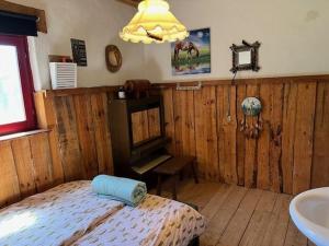 a bedroom with a bed and a sink in it at Relaxed Guesthouse in Heibloem +30 photos