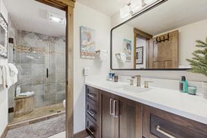 a bathroom with a sink and a shower at The Pines Condo Unit 2044 in Keystone +16 photos
