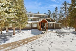 a house in the snow with its door open at The Pines Condo Unit 2044 in Keystone