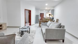 a living room with a couch and a table at Witu Apartments in Lusaka