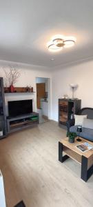 a living room with a couch and a table at Ferienwohnung Tschitschmann in Naumburg