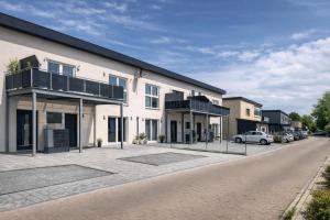 an apartment building with a car parked in the driveway at Modern Royal Suite in Hirschaid
